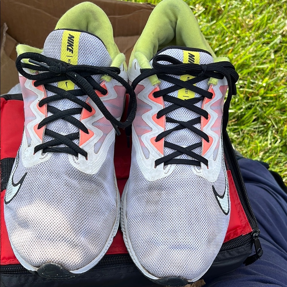 Nike White and Black Athletic Shoes with Modern Design